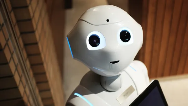 A white humanoid robot representing AI data pipelines in the Firecrawl versus Apify comparison