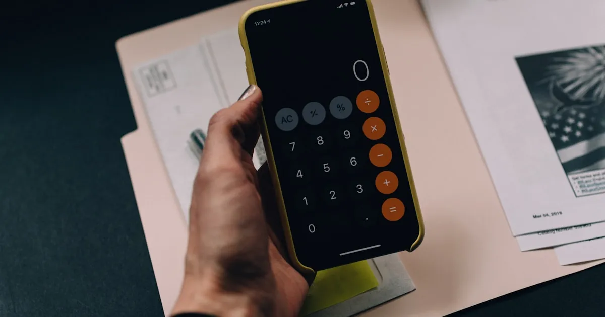 Calculator and financial charts showing pricing calculation