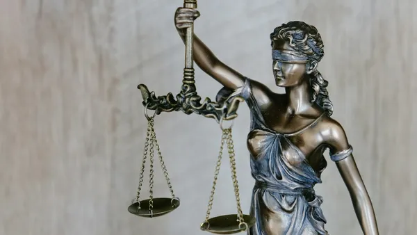 A judge's gavel beside law books symbolizing web scraping law